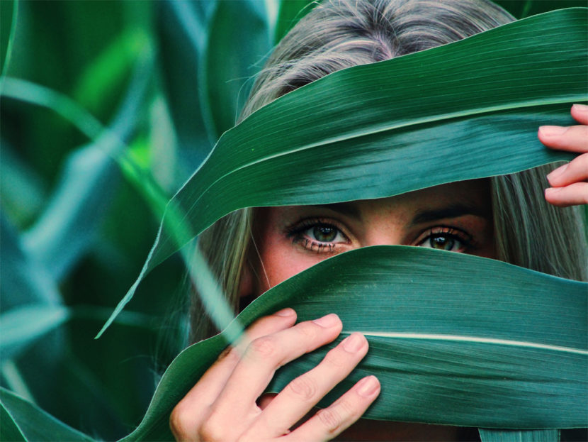 Woman Hiding Behind Leaves